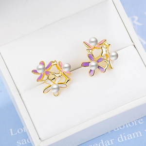 Floral stud earrings with purple and pink petals and pearls on a gold-plated base