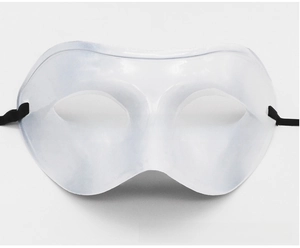 Close-up of white plastic half-face mask with black elastic strap for masquerade events