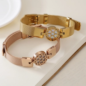 Mesh stainless steel bracelets in gold and rose gold with heart floral centerpieces