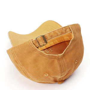 Detail of vintage washed baseball cap with adjustable metal buckle and embroidery