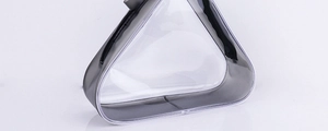 Detailed side view of a triangular transparent PVC travel pouch with gray trim and zipper