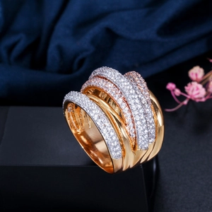 Macro shot of gold-plated wide band ring with five rows of micro-paved AAA zircons