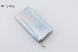 Macro detail of holographic PU leather long wallet with smooth metal zipper closure