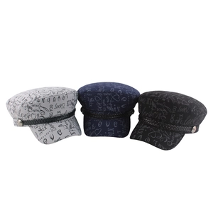 Graffiti printed flat top captain hats in grey, navy, and black with braided cord detail