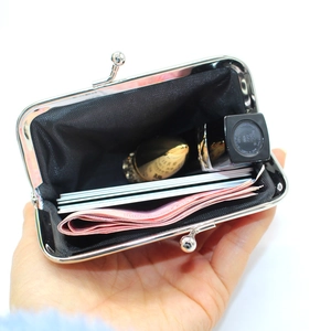Litchi pattern PU leather coin purse with silver frame shown holding cards and lipstick