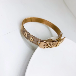 Detail of rose gold stainless steel mesh band bracelet with adjustable buckle closure