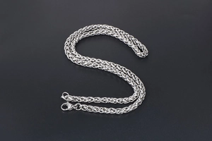Detailed view of silver stainless steel wheat chain necklace with lobster clasp closure