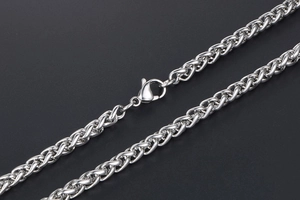 Detailed macro view of silver stainless steel dragon bone chain with lobster clasp