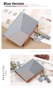 Detail of blue and gray patchwork leather wallet with tassel and cute rabbit pendant