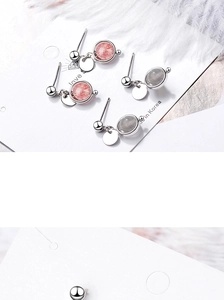 Detail shot of round strawberry quartz and grey stone studs with silver metal finish