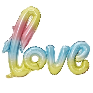 Close-up of a gradient love foil balloon featuring vibrant pink blue and yellow hues