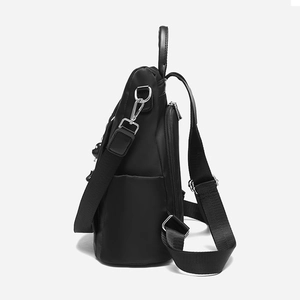 Black water-resistant Oxford cloth backpack for women with side pockets and a small charm