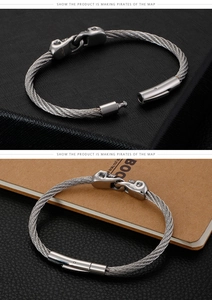 Detail of gothic stainless steel cable bracelet with skull head mechanical clasp