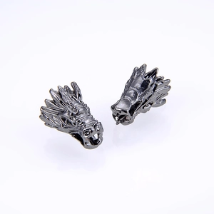 Detailed view of gunmetal dragon head charms for DIY jewelry making and bracelets