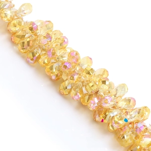 Macro detail of amber yellow AB coated faceted crystal water drop beads for DIY jewelry