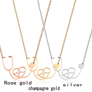 Close-up of stethoscope and heartbeat necklaces in rose gold, gold, and silver finishes
