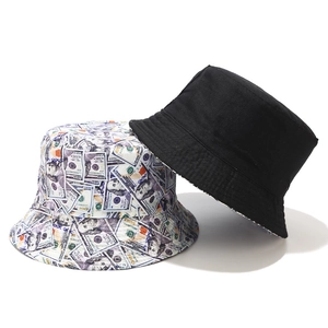 Detail of a black bucket hat and one with a dollar bill graffiti print pattern