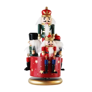 Handcrafted wooden Nutcracker rotating music box with festive red and green hand-painted details