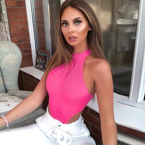 Rose pink sleeveless ribbed knit bodysuit and white drawstring pants set on model