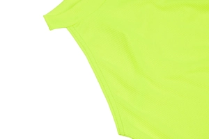 Detail of neon green ribbed knit fabric featuring high-quality double-stitched seams