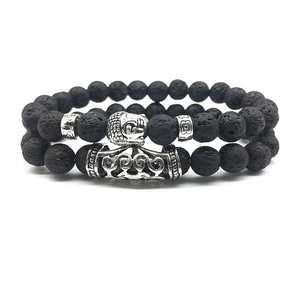 2-piece set of black lava stone bracelets with vintage silver Buddha head and charm tube