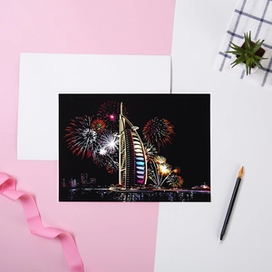 City night scene scratch art of Dubai Burj Al Arab with fireworks and scratch pen tool