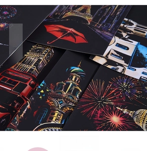 Detailed close-up of A4 city night scratch art cards with iconic global landmarks
