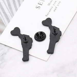 Punk skeleton hand holding heart lollipop brooches with butterfly clasp back detail