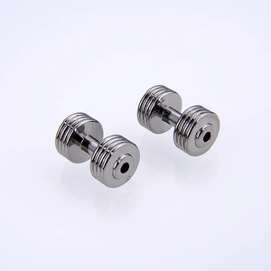Macro shot of dark grey dumbbell beads with vintage striped metal texture for DIY jewelry