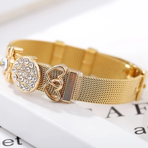 Golden mesh strap bracelet with sparkling rhinestone charm and double heart pendant