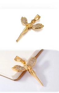 Detail of gold angel wing pendant with white crystals and yellow teardrop gemstone