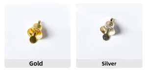 Close-up of small decorative metal bells in gold and silver plating for Christmas decor