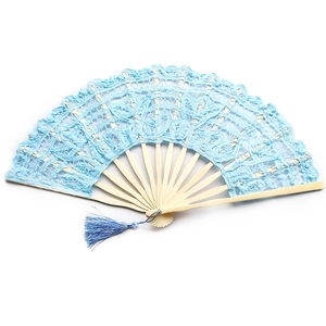 Detailed view of light blue lace folding fan with floral patterns and bamboo ribs