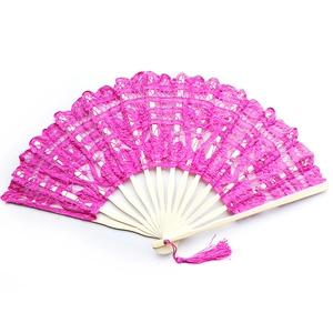 Detailed view of pink lace folding fan with natural bamboo ribs and matching tassel