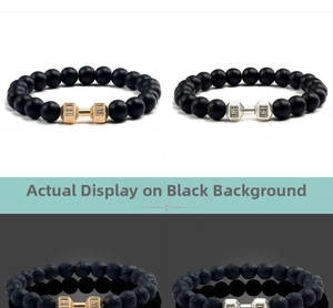 Detail of matte black beads and dumbbells with engraved LIVE LIFT lettering on bracelet