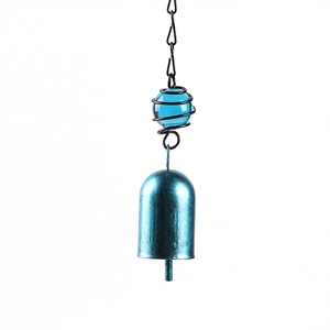 Close-up of blue metal bells and glass ball wind chime with spiral spring detail