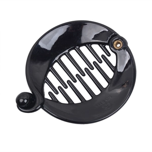 Detail view of black glossy banana hair clip with dense teeth and gold metal rivet