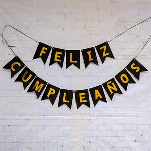 Spanish Feliz Cumpleaños birthday banner with black fishtail flags and yellow letters