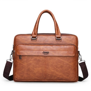 Close-up of brown oil wax leather business briefcase with handle and shoulder strap