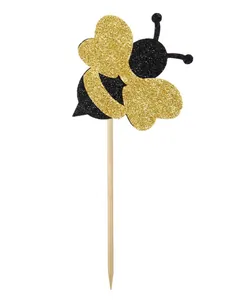 Glittery gold and black honeybee cake toppers for children's birthday party decorations