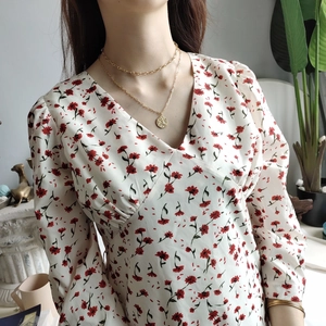 Floral V-neck long sleeve dress for women paired with a layered gold coin necklace