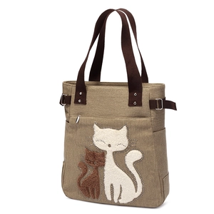 Khaki canvas tote bag with cute cat embroidery and brown woven straps for daily shopping