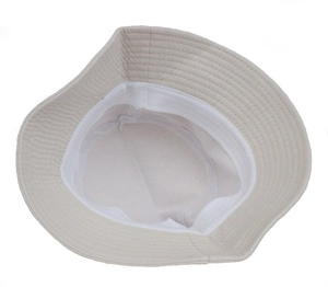 Detail view showing the cotton lining and interior sweatband of this beige bucket hat