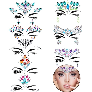 Detail showing various crystal face rhinestones and tattoo stickers for makeup looks