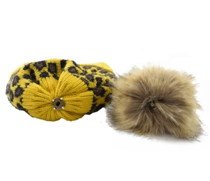 Leopard print knit hat with detachable brown faux fur pom-pom and metal snap button