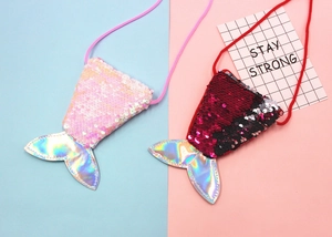 Detail of mermaid tail sequin coin purses with shiny scales and colorful braided ropes