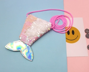 Macro detail of mermaid tail coin purse with pink sequins and laser gradient material