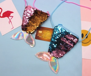 Detail of mermaid tail coin purse with dual-tone sequins and shimmering finish
