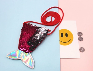 Detail showing mermaid tail sequin coin purse with holographic fin and red shoulder strap