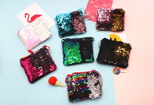 Detail of reversible sequin mermaid coin purses in seven vibrant color combinations